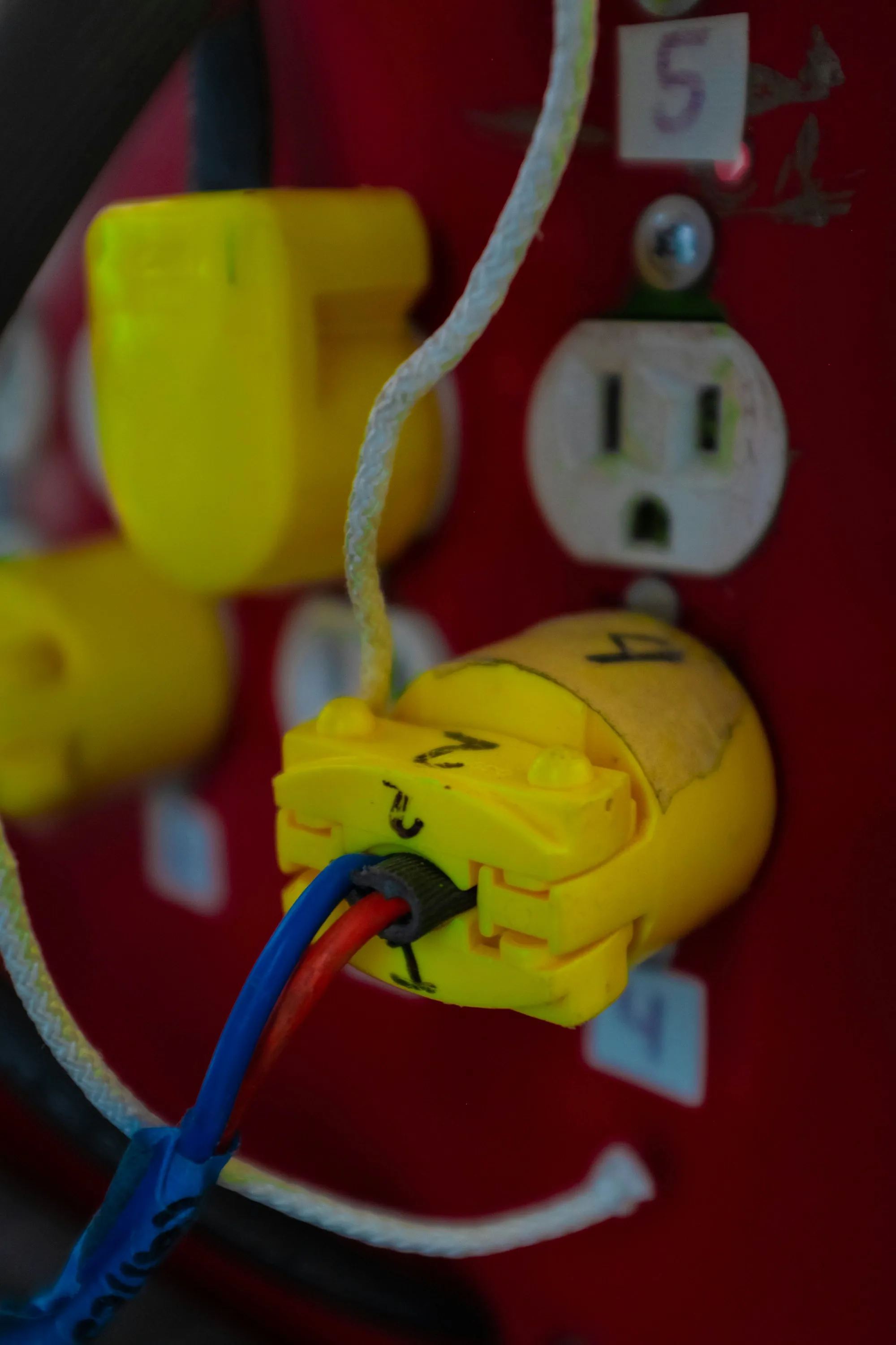 Heavy-duty plug in a wall outlet