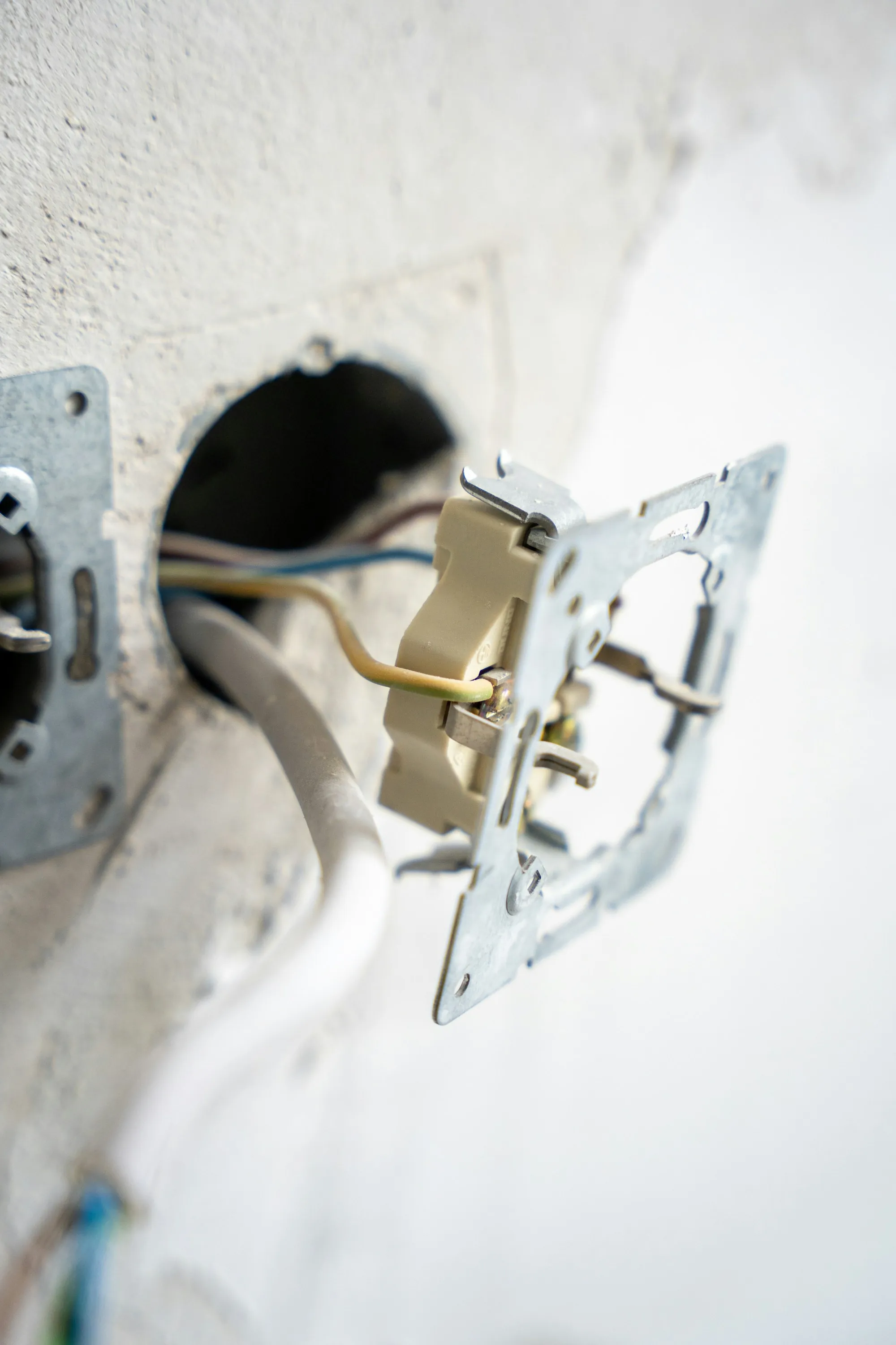 Outlet box opened to show its wiring