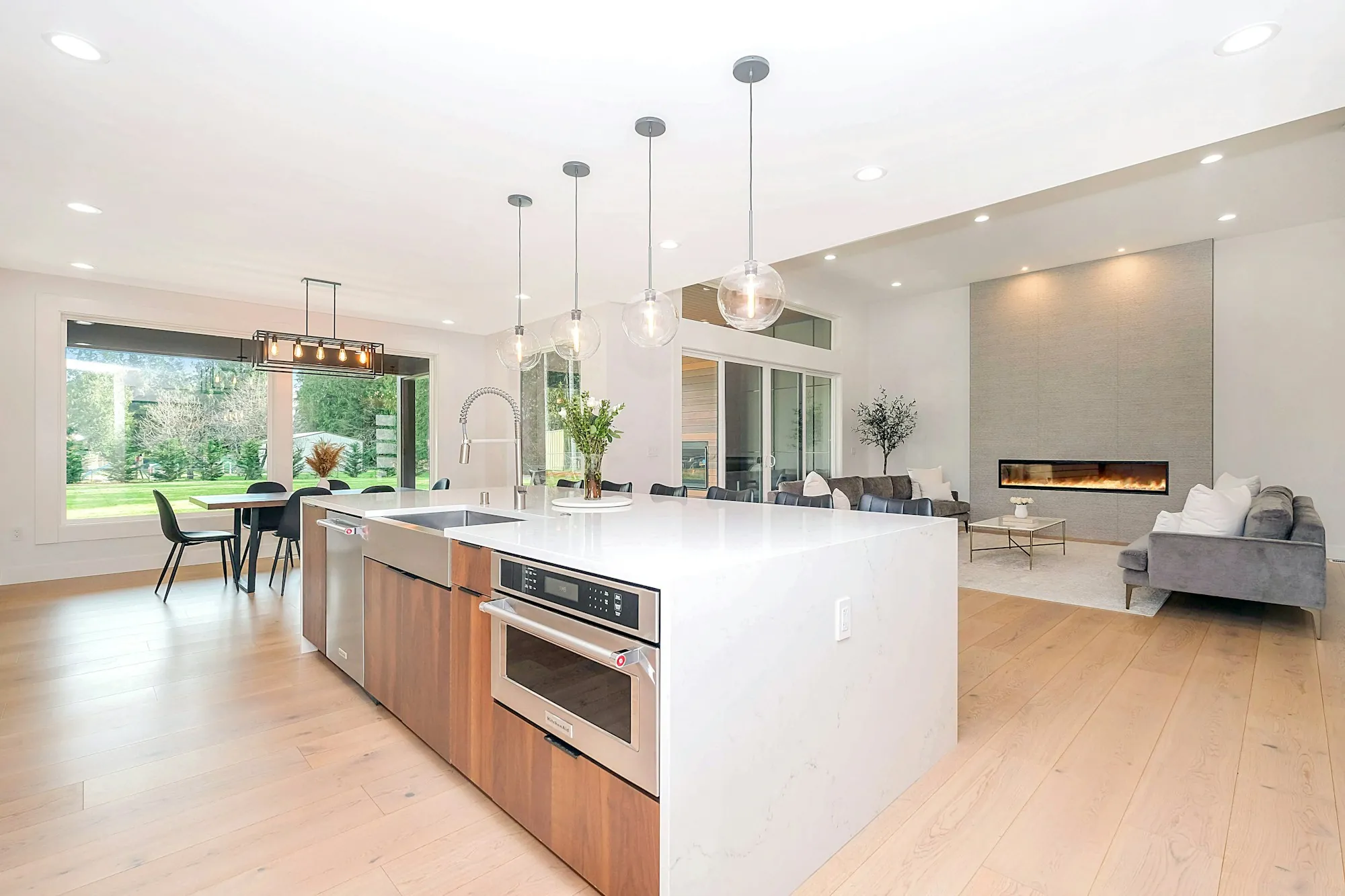 Bright open kitchen with pendant lights above a long island