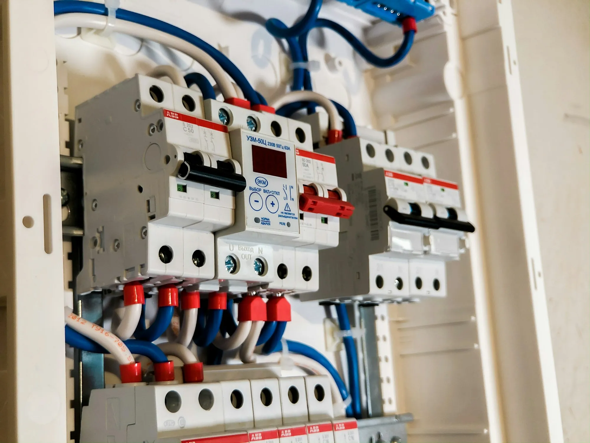 Rows of breakers and neat wiring inside a panel